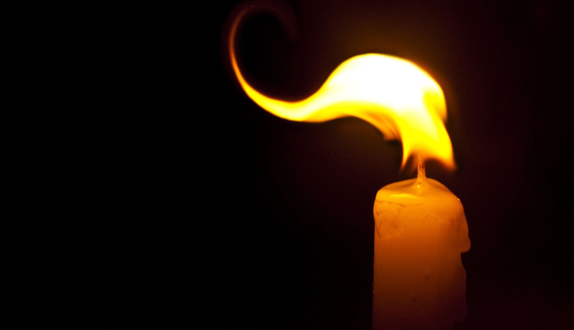 A candle burning in a quiet room